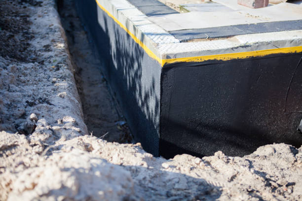 Professional Waterproofing technician working in Casnovia, MI